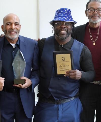 Formerly incarcerated advocates and practitioners pose with awards at our Bronx Community Solutions' reentry forum and resource fair.