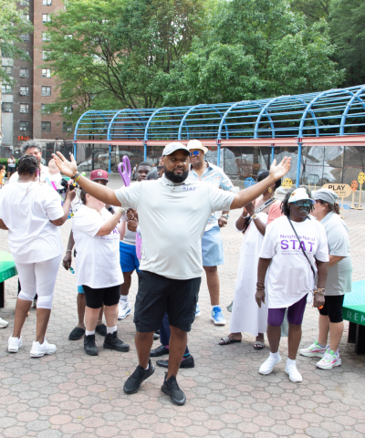 Community members celebrate unveiling of new "playscape" in Harlem.