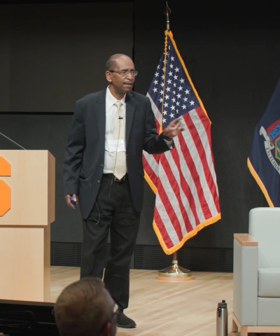 Judge Robert T. Russell speaks onstage at the Veterans Treatment Court Summit in Syracuse, New York.