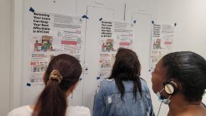 Three people reading NYCHA tenant guide posters on wall.