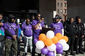 A group of male advocates from CONNECT speak at RISE's Domestic Violence Awareness Month Rally.