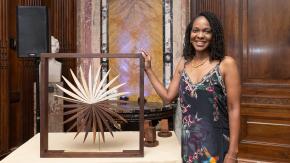 Author Imani Perry stands next to Inside Literary Prize award after winning inaugural prize for her book "South to America."