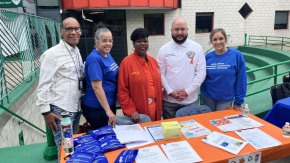 Group of Bronx HOPE staff pose with Council Member Salamanca Jr. and Bronx DA Clark for a picture while tabling harm reduction materials