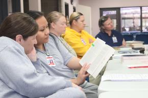 Inside Literary Prize 2024 judges photographed while reading in Shakopee MN