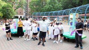 Community members celebrate unveiling of new "playscape" in Harlem.