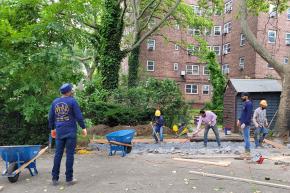 people working on shipping container legacy project at Patterson Houses