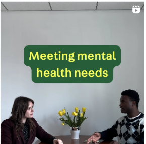 Two people sit at table, in discussion, with text overlay above their heads that reads "Meeting mental health needs"