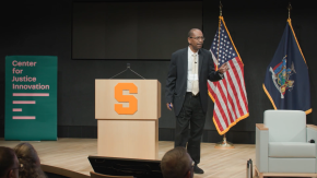 Judge Robert T. Russell speaks onstage at the Veterans Treatment Court Summit in Syracuse, New York.