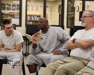 Three judges of the Inside Literary Prize discuss Roger Reeves' book "Best Barbarian" in a reading circle at the North Dakota State Penitentiary.